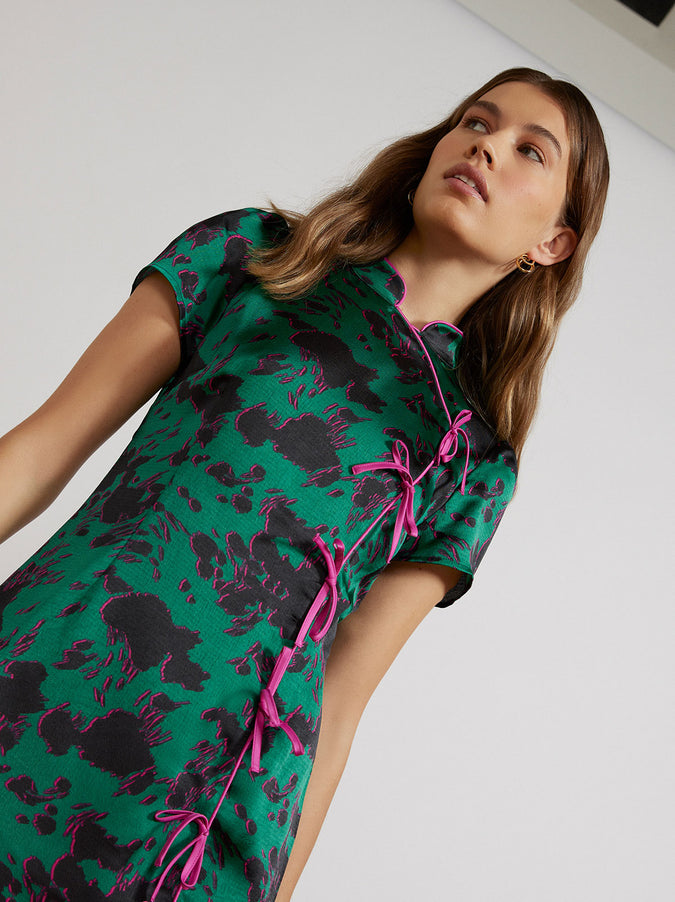Harlow Green Cow Print Mini Dress by KITRI Studio