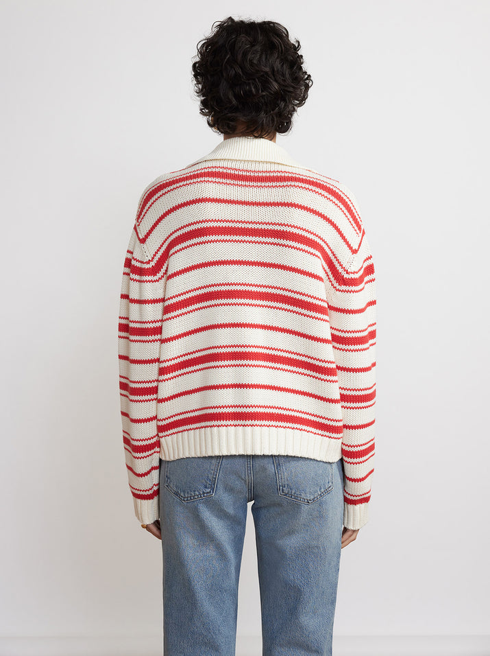 striped sweater and red jeans